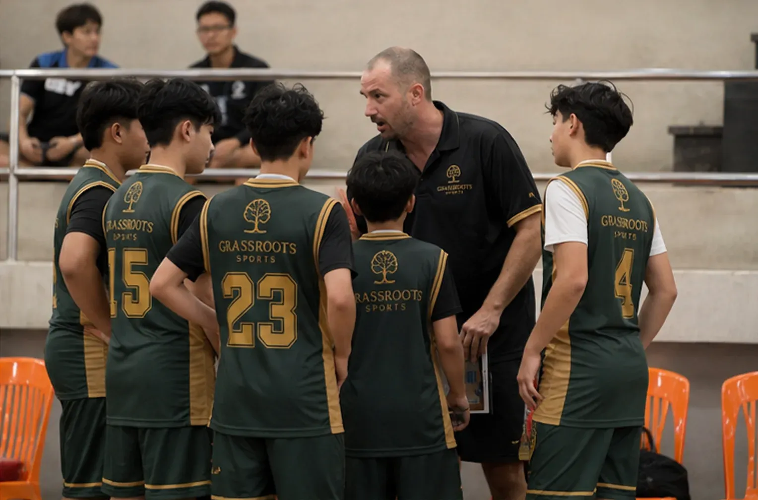 Coach and players in huddle